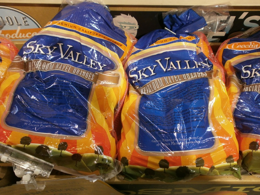 Bags of Sky Valley Heirloom Navels sitting on boxes at Whole Foods Market