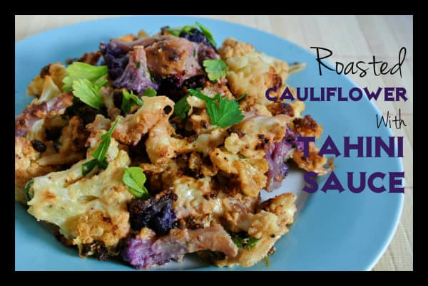 Tahini Roast Cauliflower sitting on a blue colored plate