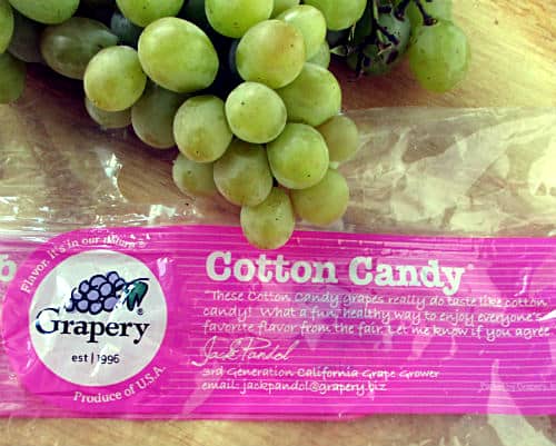 Cotton Candy Grapes on top of a plastic bag that from Grapery.