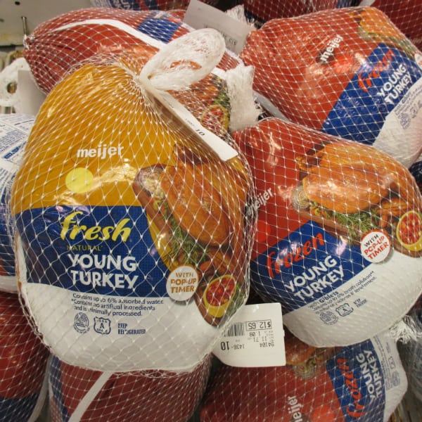 A Meijer fresh turkey next to a Meijer frozen turkey.