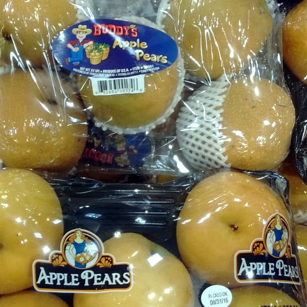 Packages of wrapped up Apple pears at at Costco store.