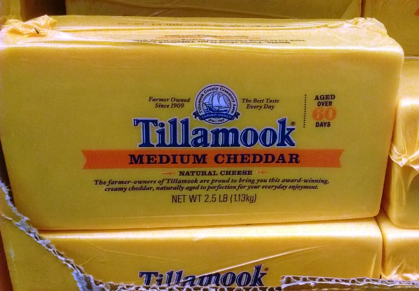 A 2.5 loaf of Tillamook Medium cheddar cheese at a Costco store.