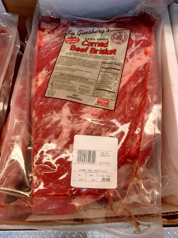 Sy Ginsberg's USDA Choice Corned Beef in it's package on display at a grocery store.