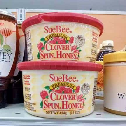 Containers of SueBee Clover Spun Honey at the store