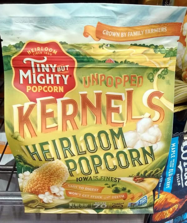 A colorful bag of Tiny But Mighty Popcorn at the grocery store.