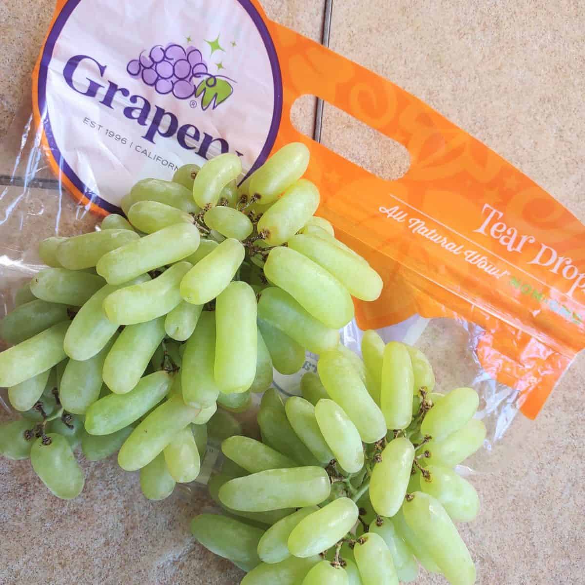 Green Tear Drops grapes on top of the bag.