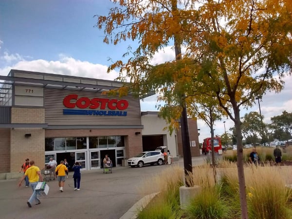 Picture of the front of Costco store in the fall with the leaves changing color.