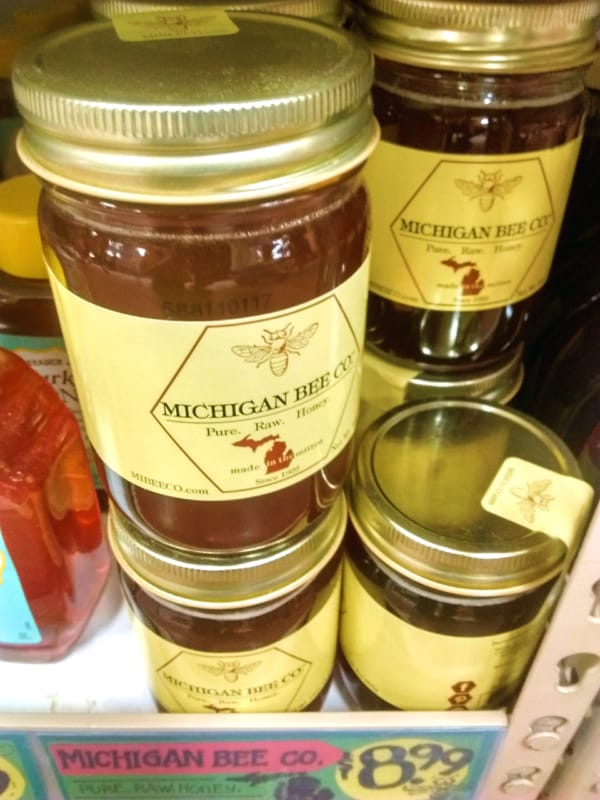 Michigan Bee Company Pure Raw Honey jars at the store.
