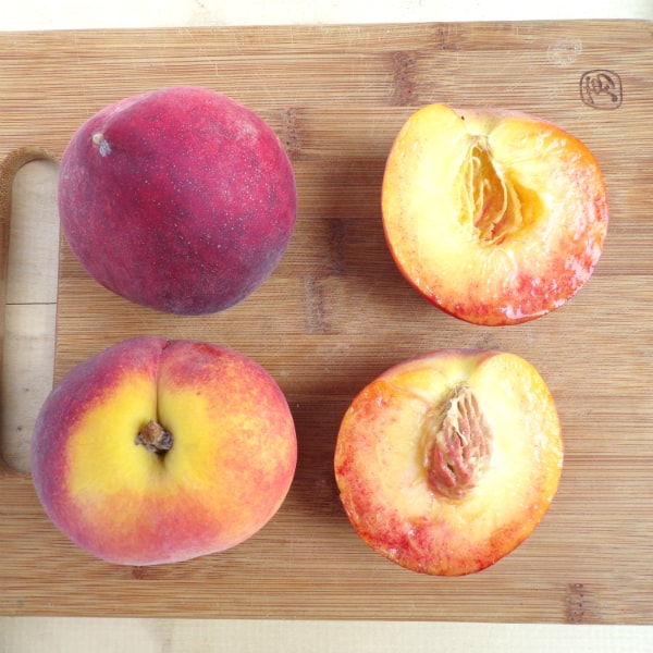 4 Blaze Prince peaches sitting on a cutting board