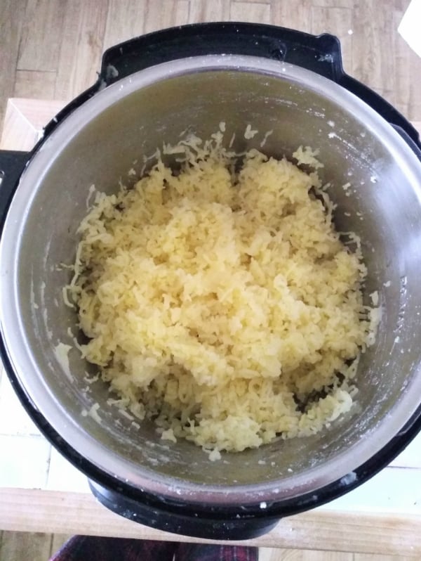 Riced potatoes inside the pot of the Instant Pot