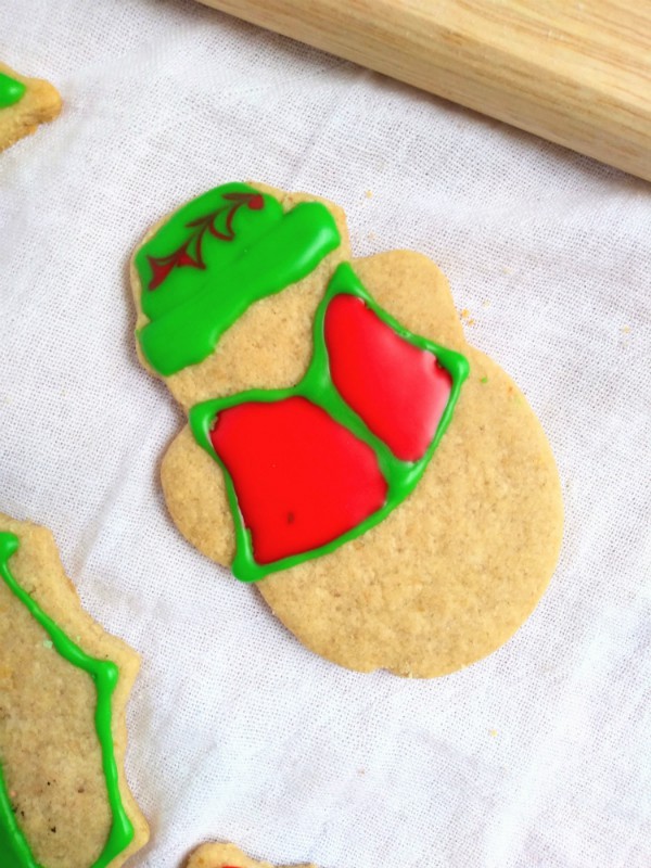 Decorated Snowman sugar cookie on a white towel