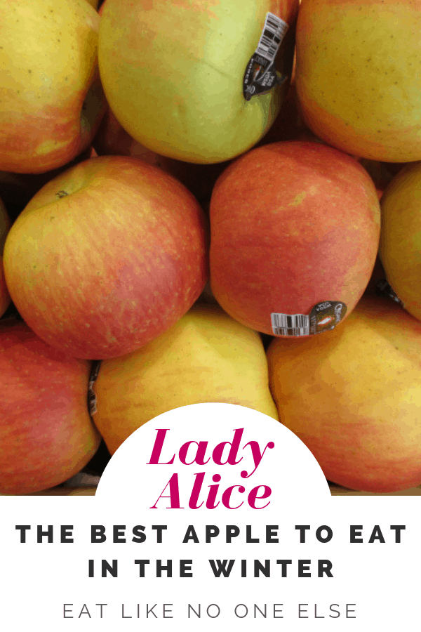 A display of Lady Alice apples at the store with the words "Lady Alice the Best apple to eat in the winter"