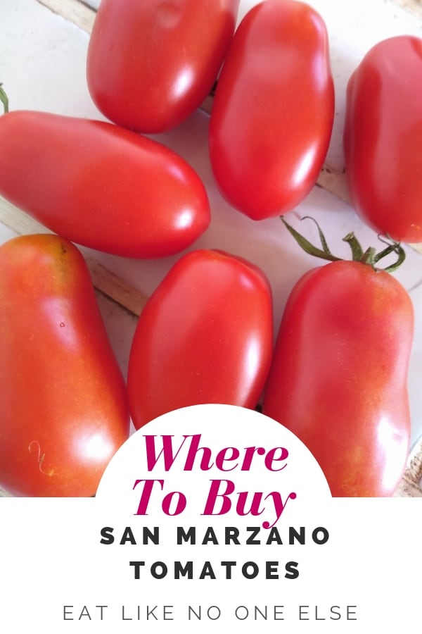 Red tomatoes on a counter with the words "Where to Buy San Marzano Tomatoes" underneath.