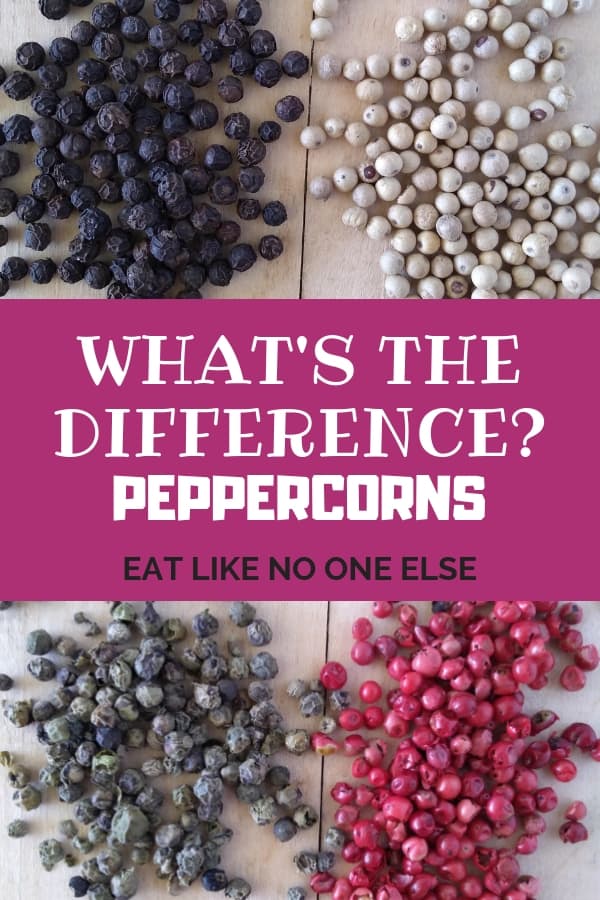 Black, White, Green, and Pink Peppercorns sitting on a wood tray with the words "What's the Difference - Peppercorns" overlayed.