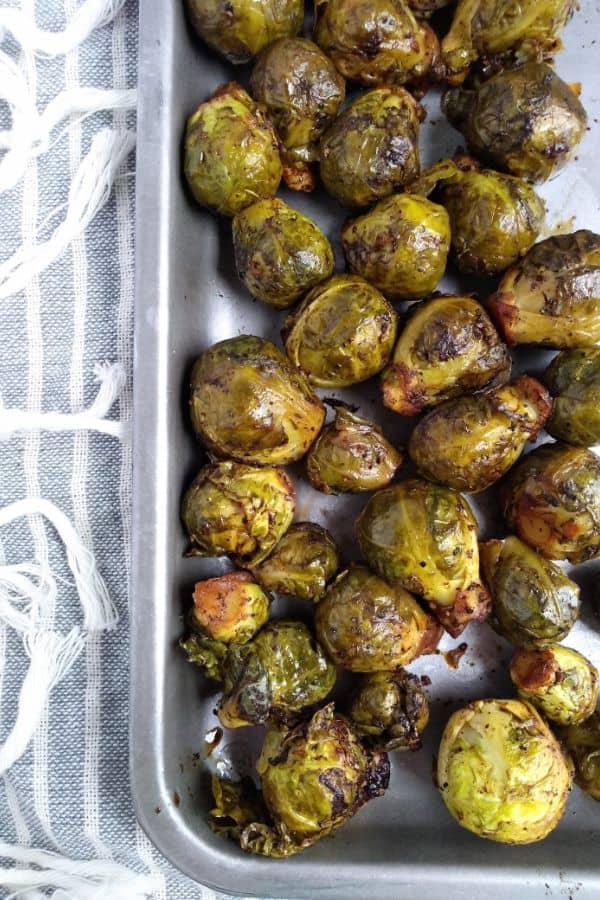 Sous Vide Brussels Sprouts on a tray. The sprouts have been browned in the oven.