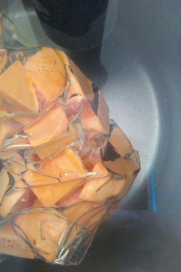 Cubed sweet potatoes in sous vide bath