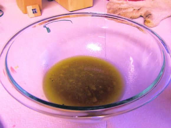 Pan drippings in a glass mixing bowl.