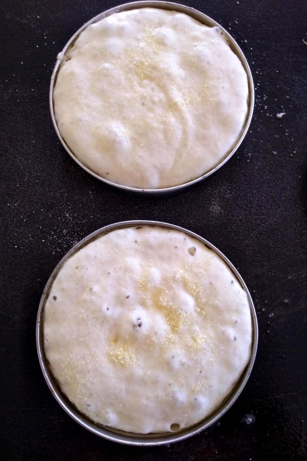 Muffins on griddle inside mason jar rings