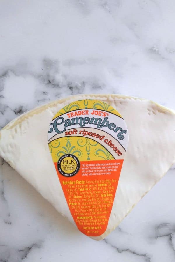 Trader Joe's Brand Camembert cheese is pictured on a counter top