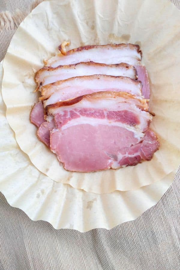 Back bacon slices in a coffee filter