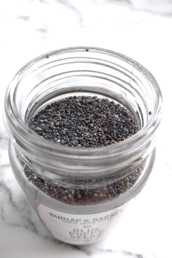 Open jar of Burlap & Barrel Blue Poppy Seeds