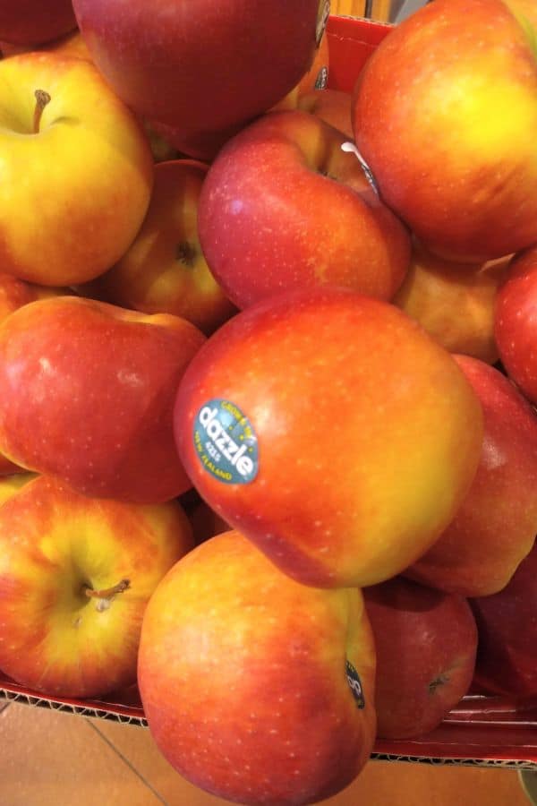 A pile of Dazzle apples at the grocery store