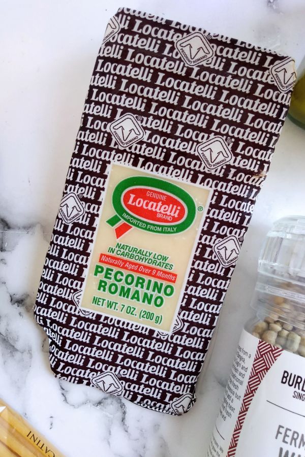 A chunk of packaged Pecorino Romano cheese from Locatelli brand.