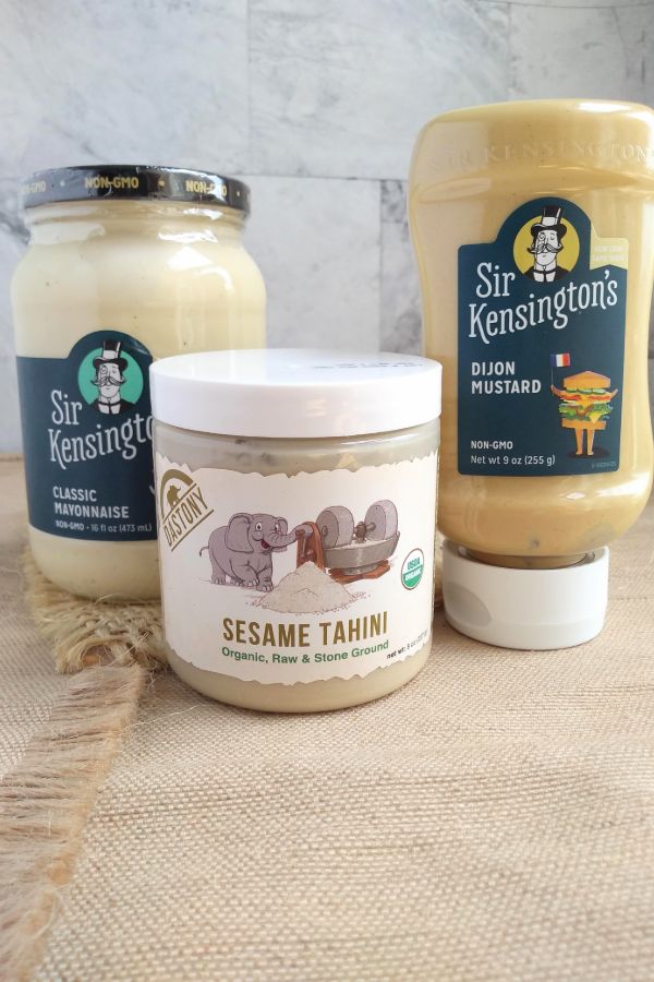 Bottles of Sir Kensington's Classic Mayonaise, Sir Kensington's Dijon Mustard, and Dastony Sesame Tahini