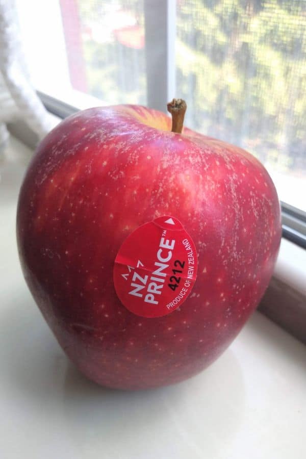 A NZ Prince apple sitting in a window sill