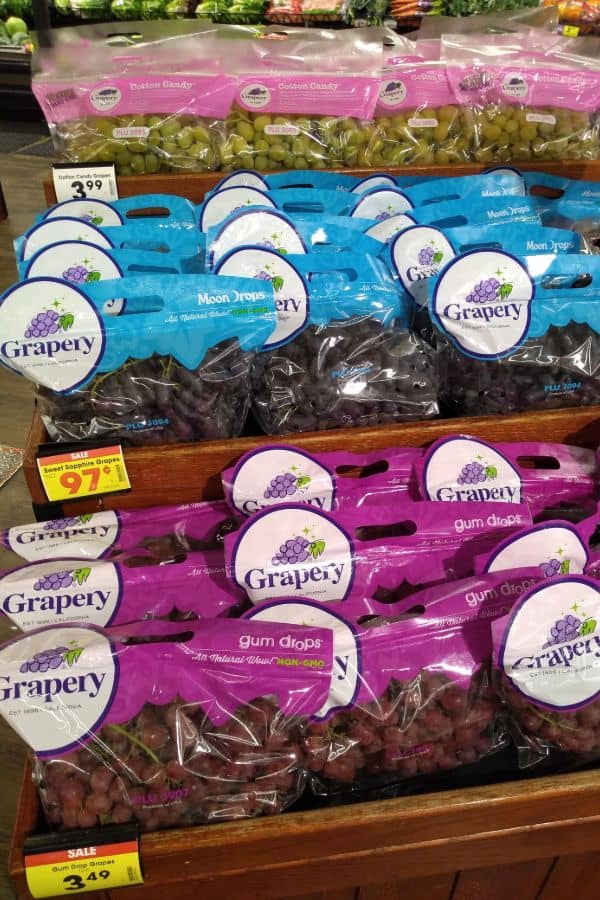 A three tired display of Grapery grapes at a Kroger store