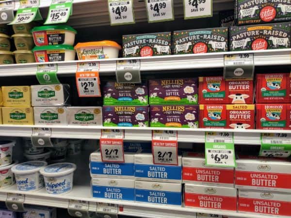 A photo of the dairy section, particularly focused on the butter choices.