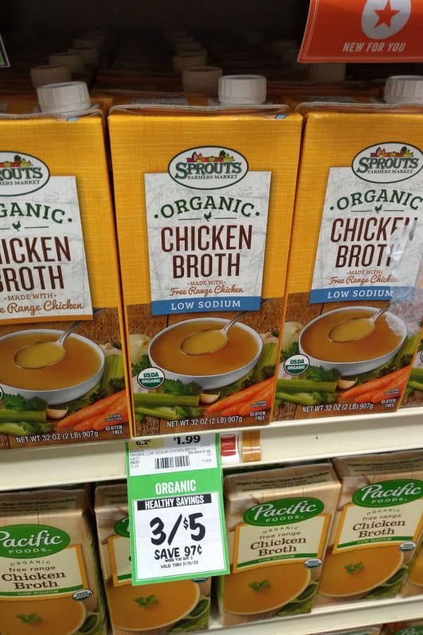 A display of Sprouts Organic Chicken Broth made with Free Range Chicken. The regular and low sodium containers are shown.