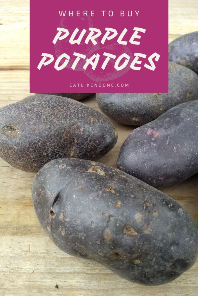 Purple potatoes sitting on a wood picnic table with the words "Where to buy Purple Potatoes" at the top.