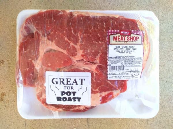 A Winco Boneless Chuck Roast is show in it's packaging. 