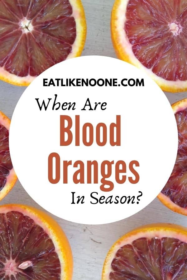 The words "When are Blood Oranges in Season" appear in a white circle overtop blood oranges that have been cut in half.