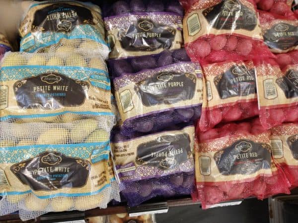 A display of small Private selection potatoes are Kroger featuring Petite White, Petite Purple and Petite Red. 