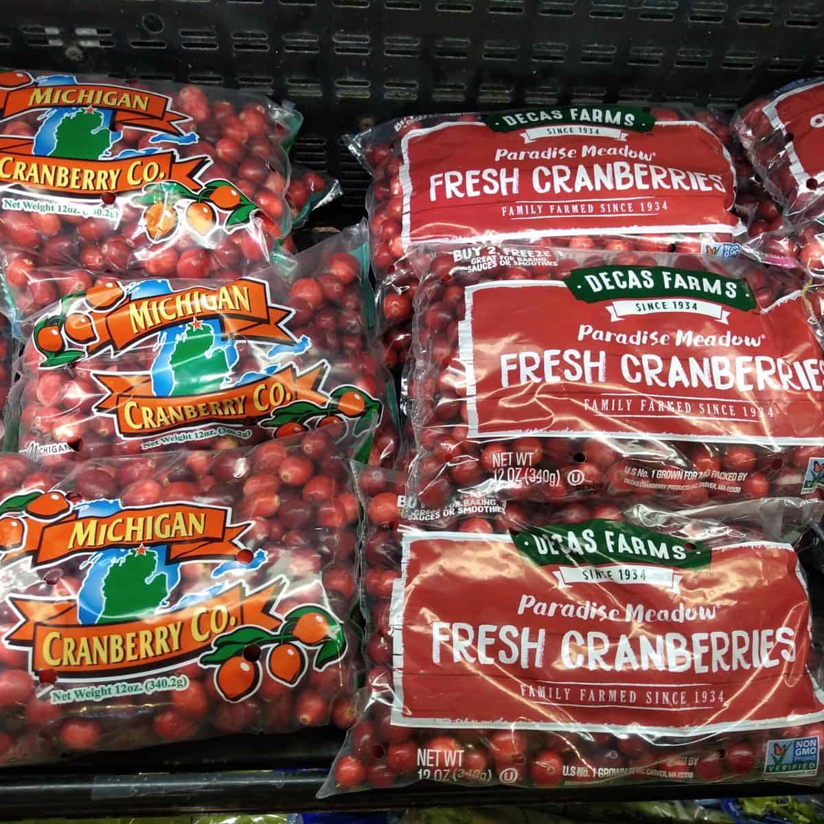 Bags of fresh cranberries at the grocery store.