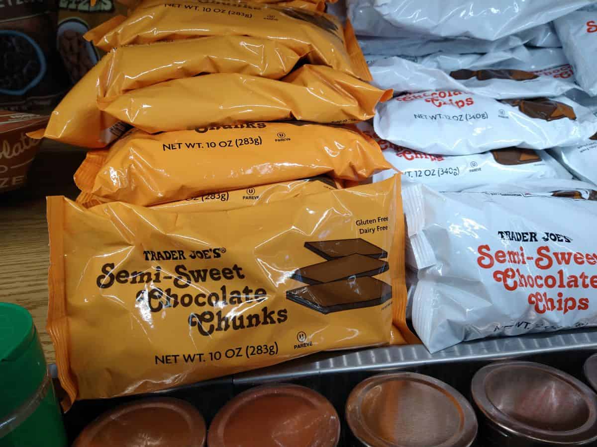 Bags of semi-sweet chocolate chunks next to semi-sweet chocolate chips