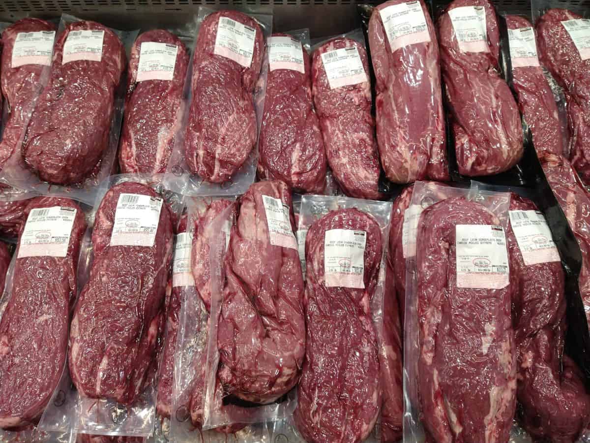 A display at Costco full of vacuum sealed prime peeled beef tenderloin.