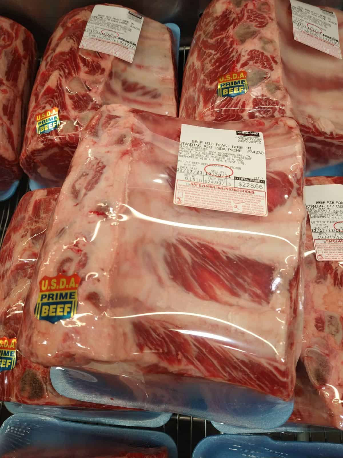 Packaged Prime Standing Rib Roasts on display at Costco.