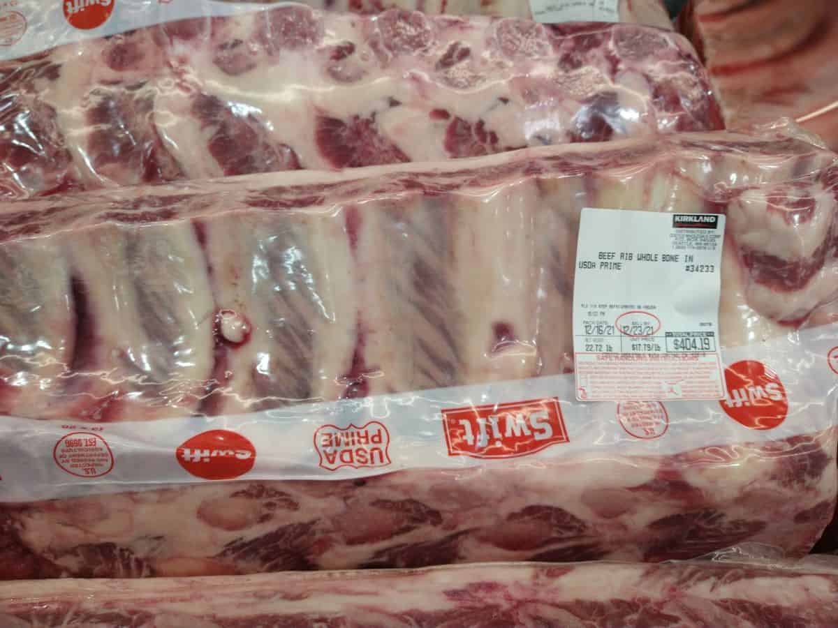 A whole bone in prime beef roast on display in Costco.