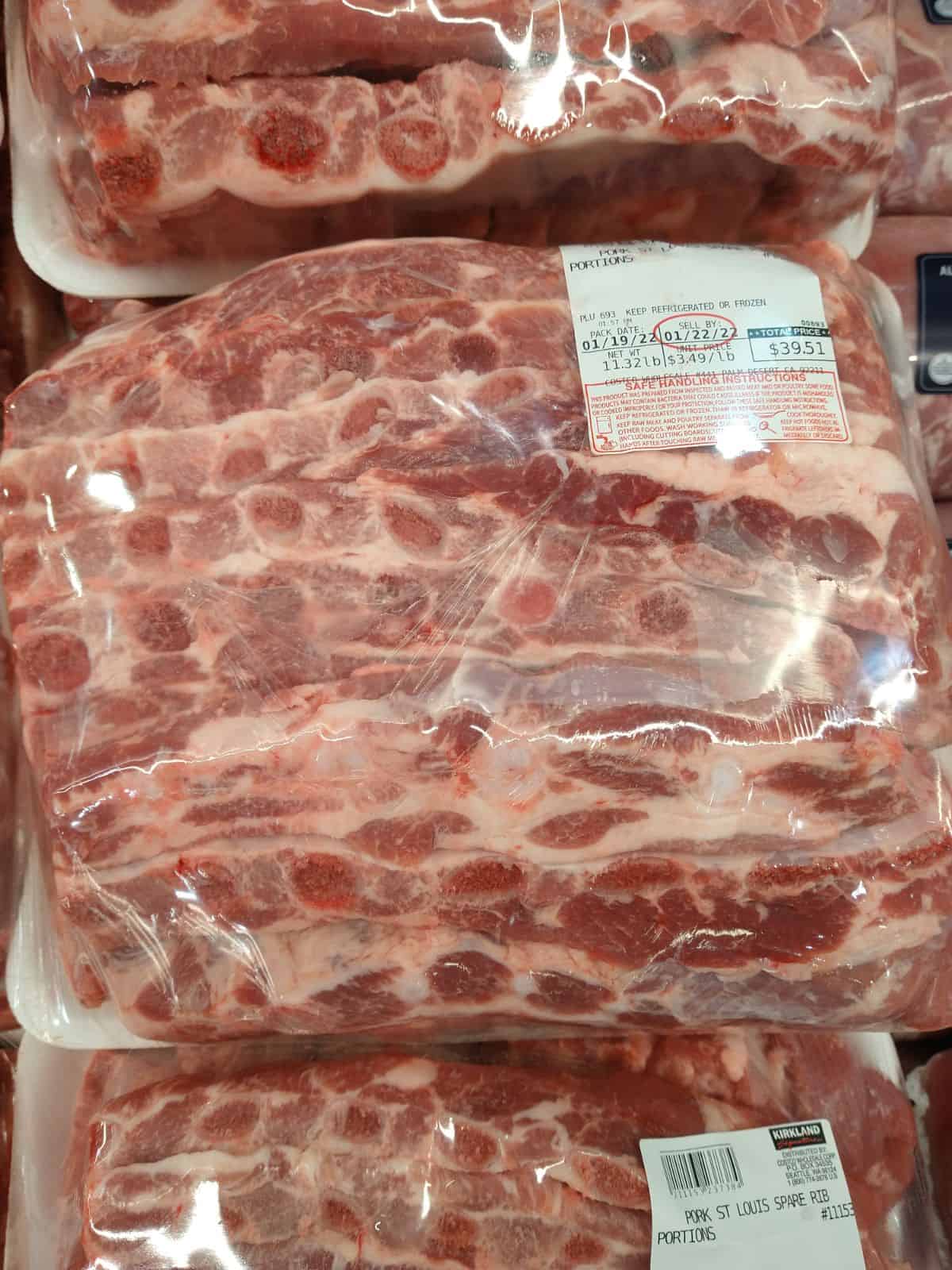 Packaged Kirkland St Louis ribs on display at Costco. The sticker says the ribs are $3.49/lb.