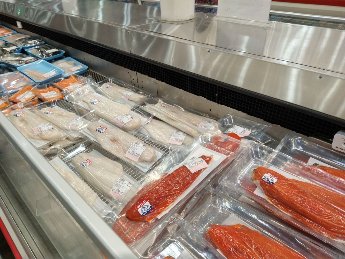 A display of different types of fresh fish at a Costco store.