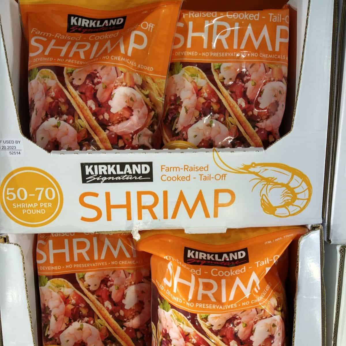 Bags of cooked tail off Kirkland Shrimp at a Costco store.