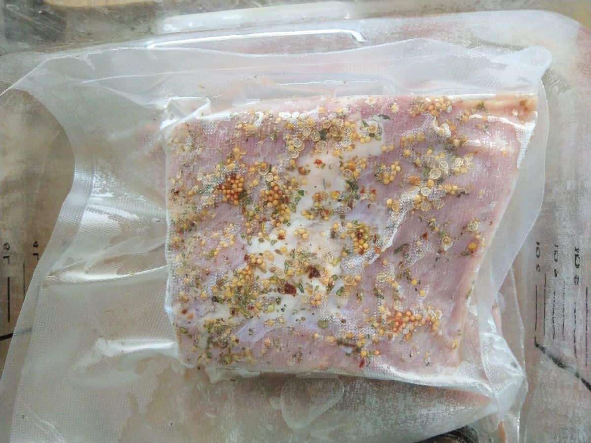 Raw Corned beef that has been sealed in a vacuum bag.