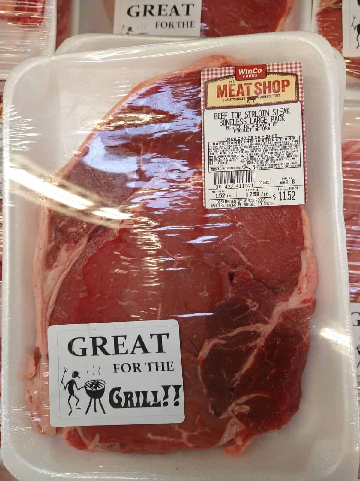 Packages of Top Sirloin steak at a Winco grocery store. The steaks are $7.58/lb