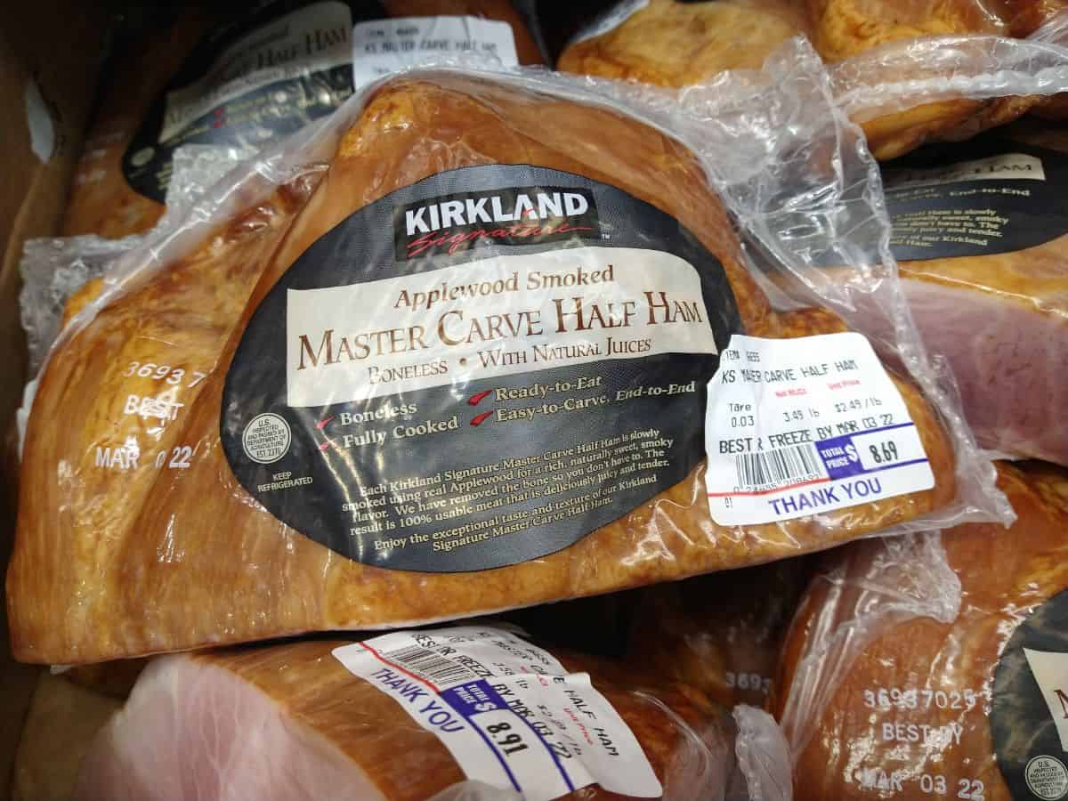 Kirkland Applewood Smoked Master Carve Half Ham in package at a Costco store.