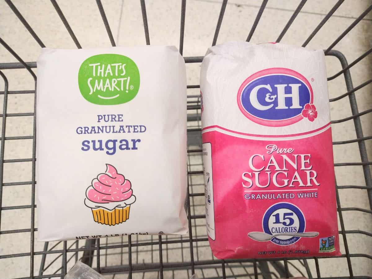 A shopping cart with That's Smart! Pure Granulated sugar next to C&H Pure Cane Sugar.