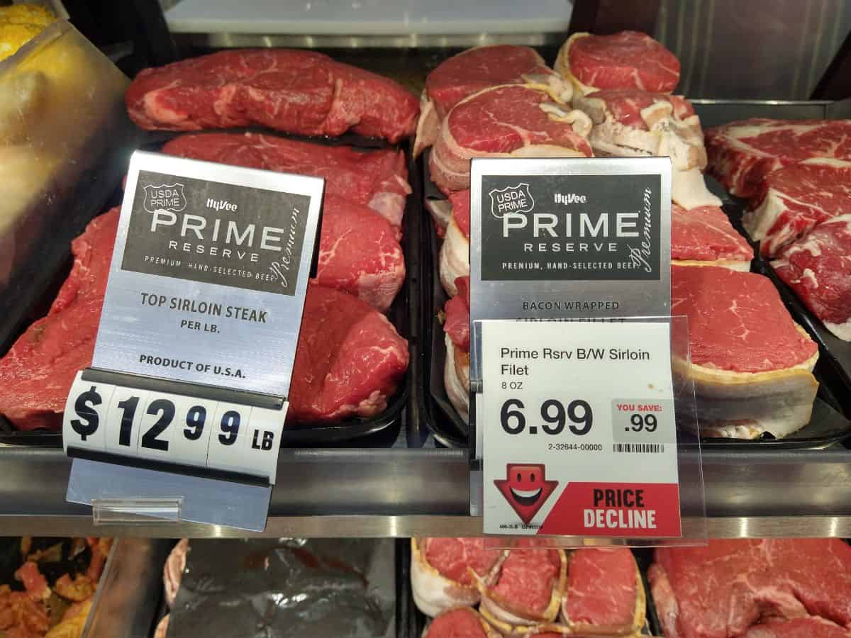 Display of prime reserve steaks at Hy-Vee. The Top Sirloin is gong for $12.99/lb and the Sirloin Filet with bacon is on sale for $6.99 for an 8 oz steak.