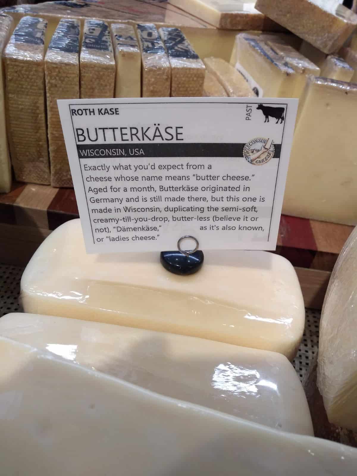A grocery store display with chunks of Butterkase cheese from Roth Kase.